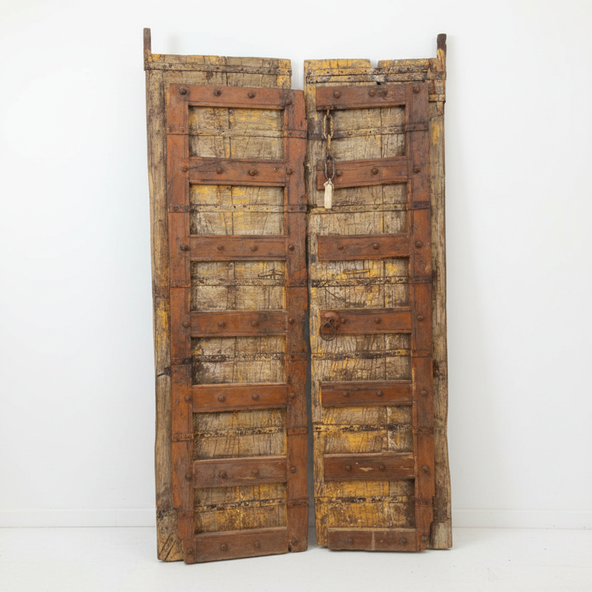 Pair of rustic wooden doors on a white background